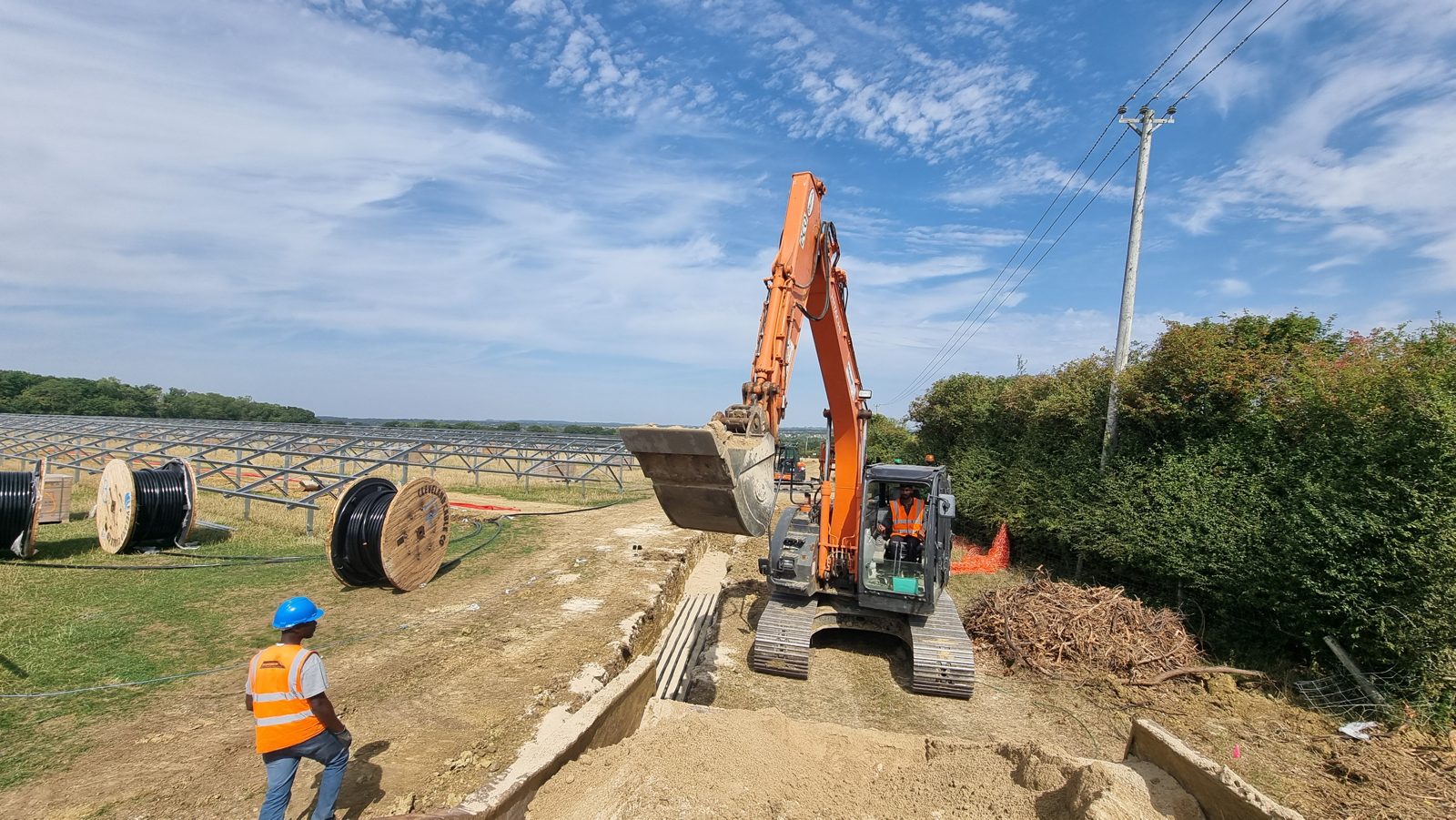 Cable trench with cable drums at a 29MW solar site in Oxfordshire.