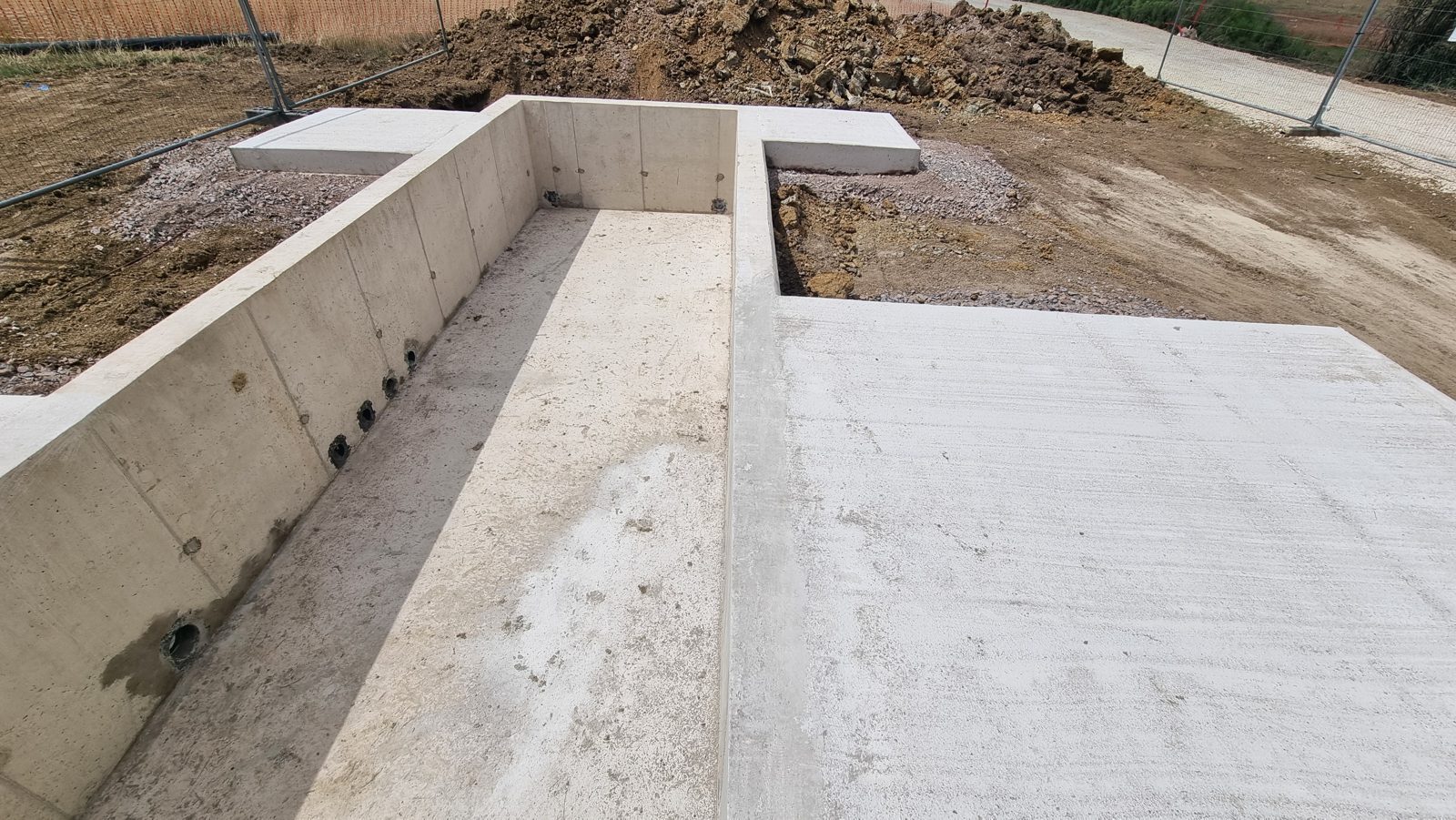A completed reinforced concrete base with cast-in duct entries in Cambridgeshire.